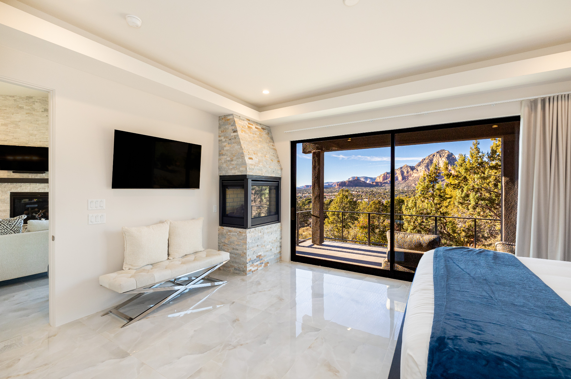 Elegant Sedona vacation rental master bedroom with panoramic red rock views
